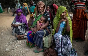People wait outside a distribution point to receive aid rations in Oromia Region, Ethiopia, in February 2018 Will Baxter/Catholic Relief Services